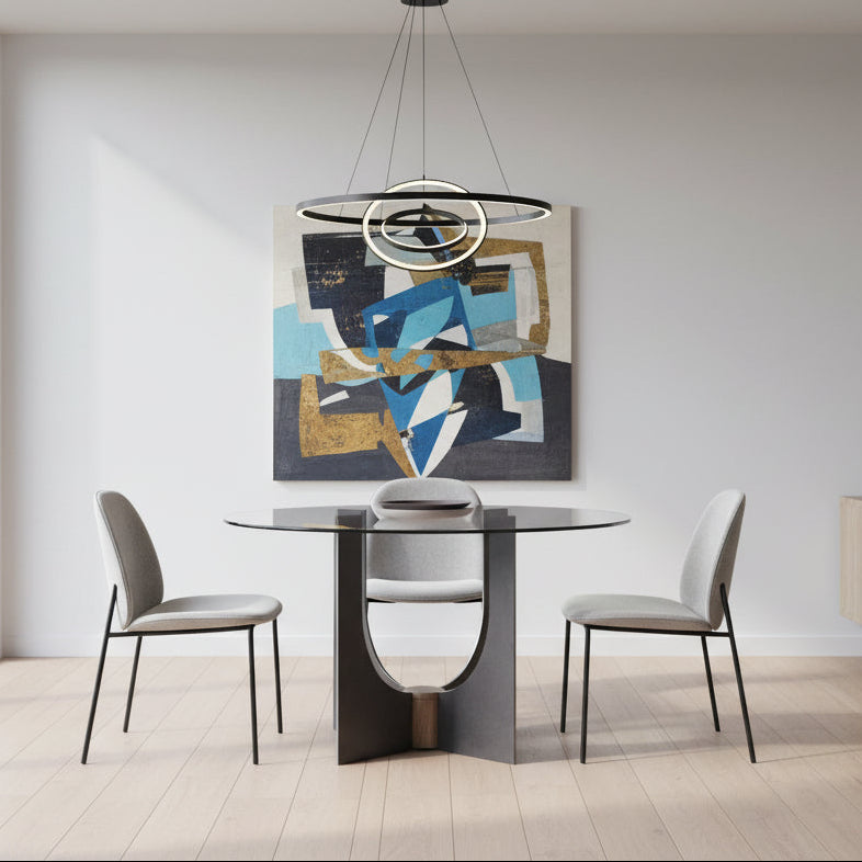 Modern glass dining table with a metallic base on a gray background